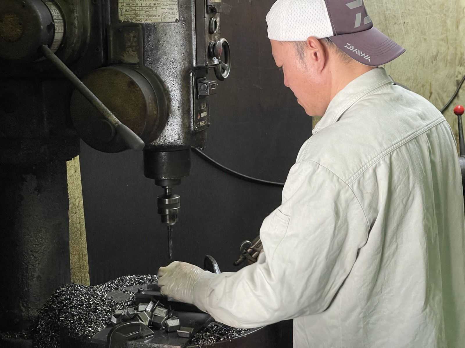 A craftsman's handwork machining an ISAJIG