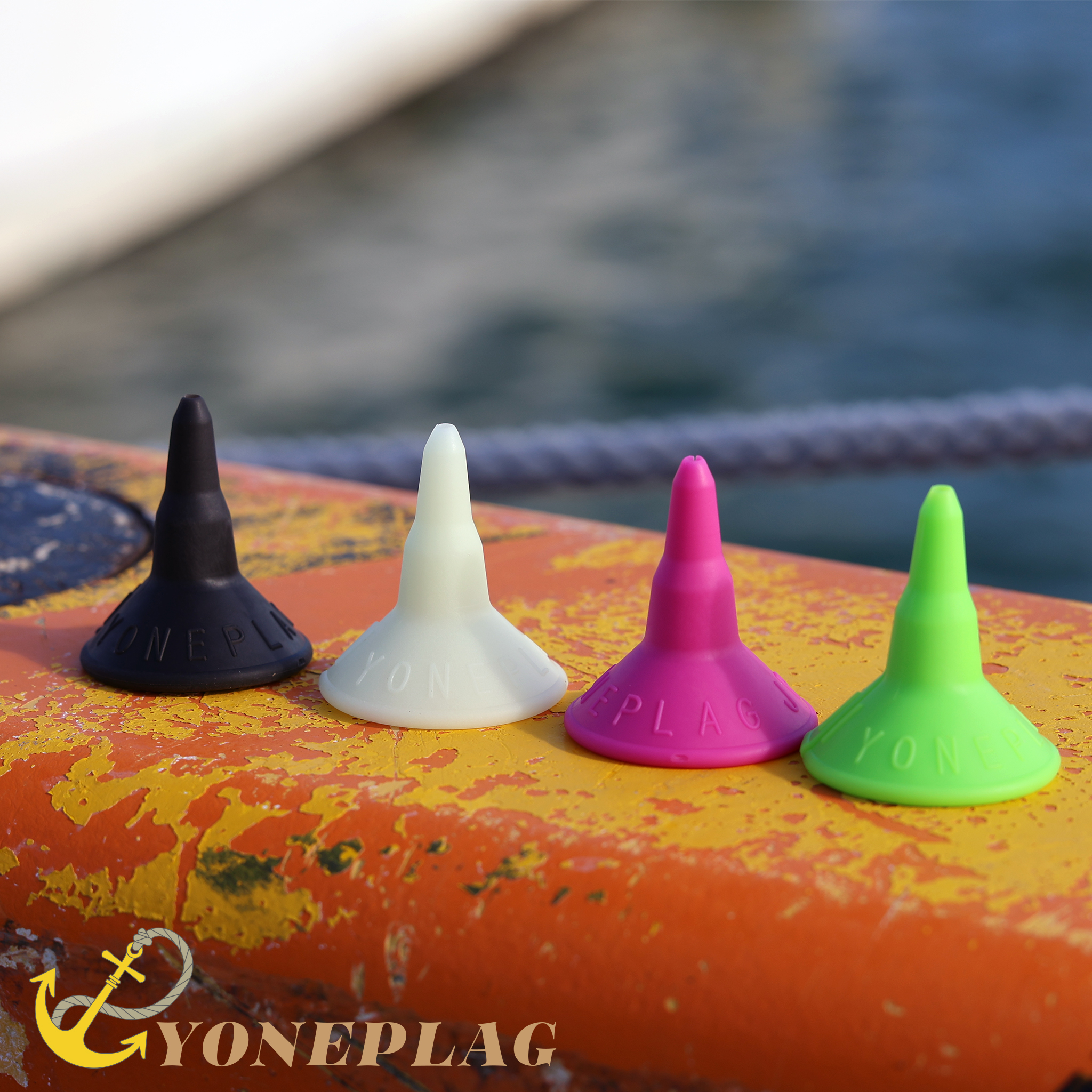 YONEPLAG in four colors lined up on a mooring bollard aboard the boat